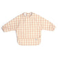 Long-sleeved bib top in pink and white gingham, snap neckline and bib front