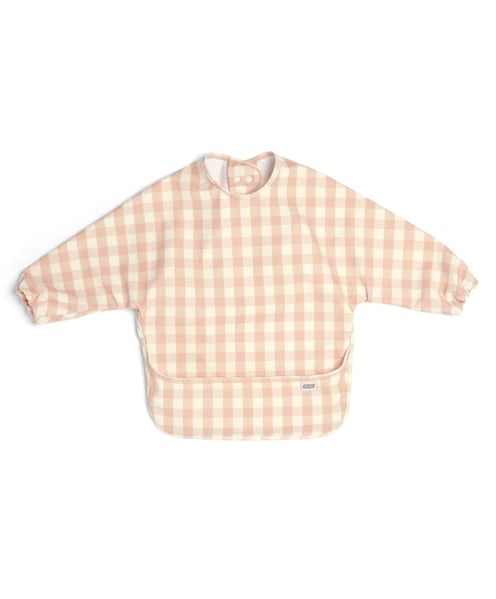 Long-sleeved bib top in pink and white gingham, snap neckline and bib front
