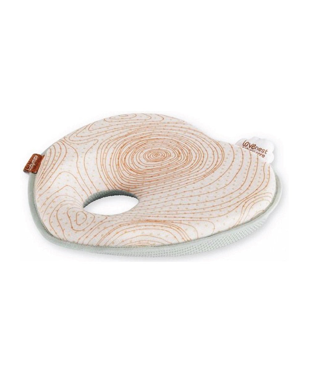 Natural Care headrest with swirl cover, mint trim, and oval neck opening