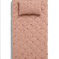 Blush pink quilted changing mat with small wildflower print and stitched border