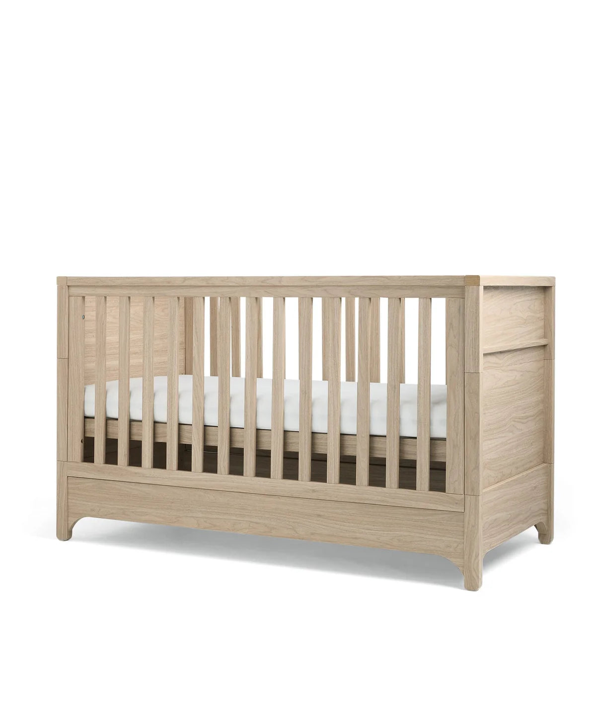 Oak cot bed front view with vertical slats and rounded corner posts