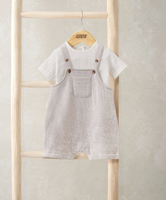 Grey short dungarees over white striped bodysuit, with front pockets and snap straps