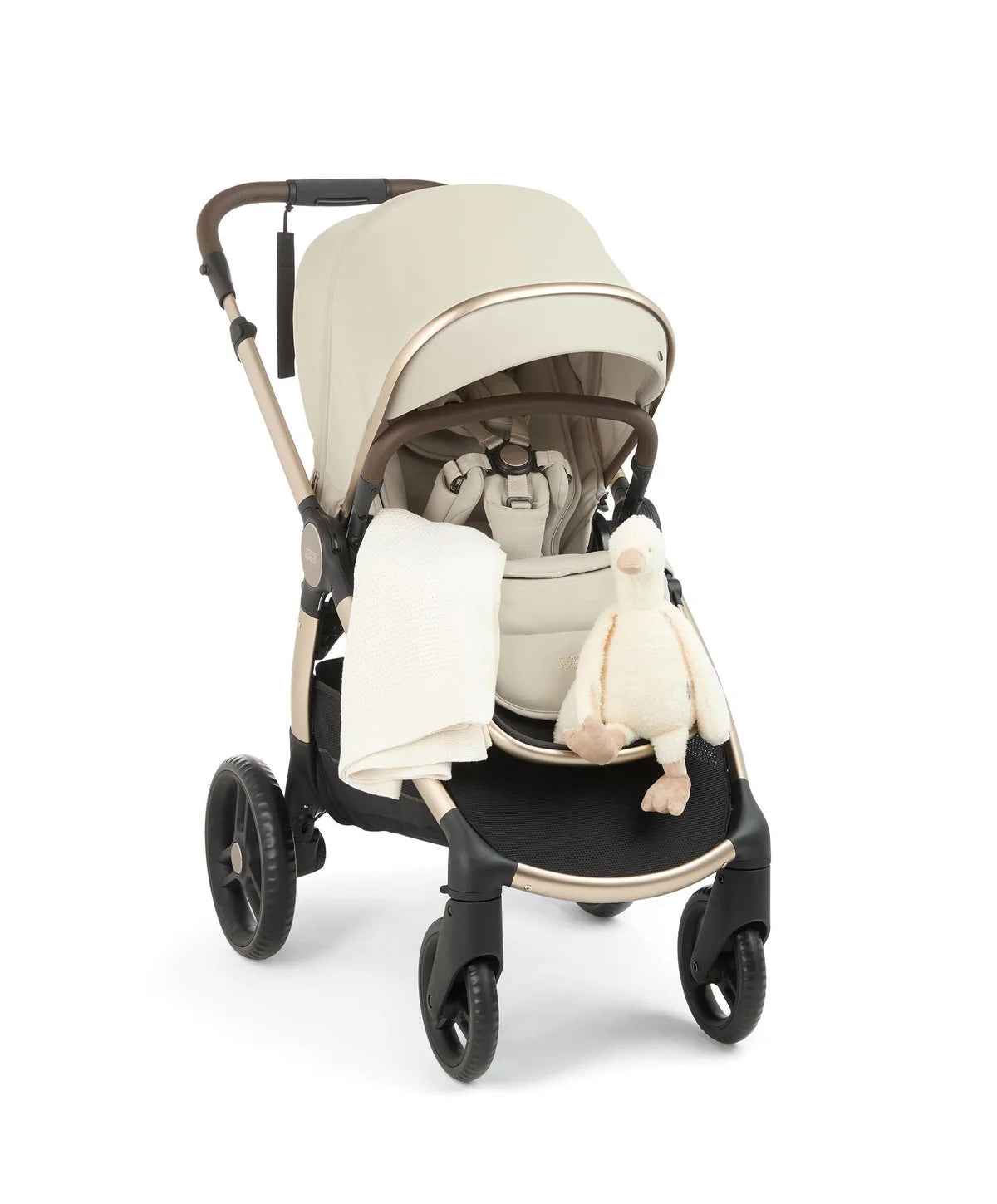 Cream pushchair with padded carrycot insert and soft plush toy accessory in seat