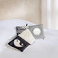 Folding fabric baby book with yin-yang fox, stripes, and round activity patch
