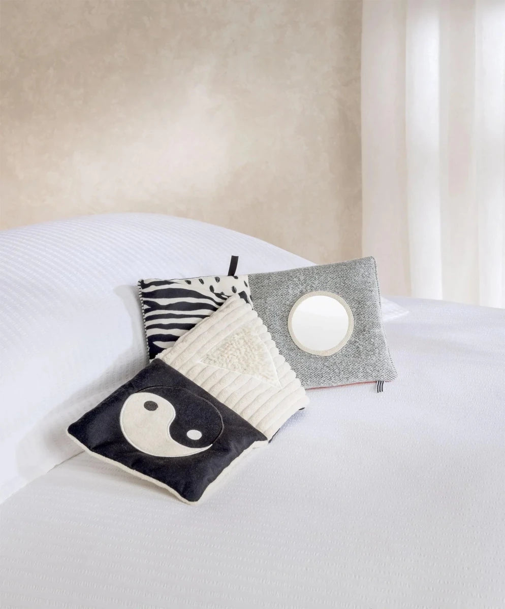 Folding fabric baby book with yin-yang fox, stripes, and round activity patch