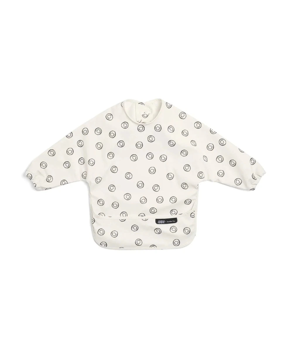 Long-sleeve baby bib, off-white with small fox-face circle print