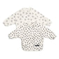 Long-sleeve baby bib, off-white with fox-face and cheetah spot prints