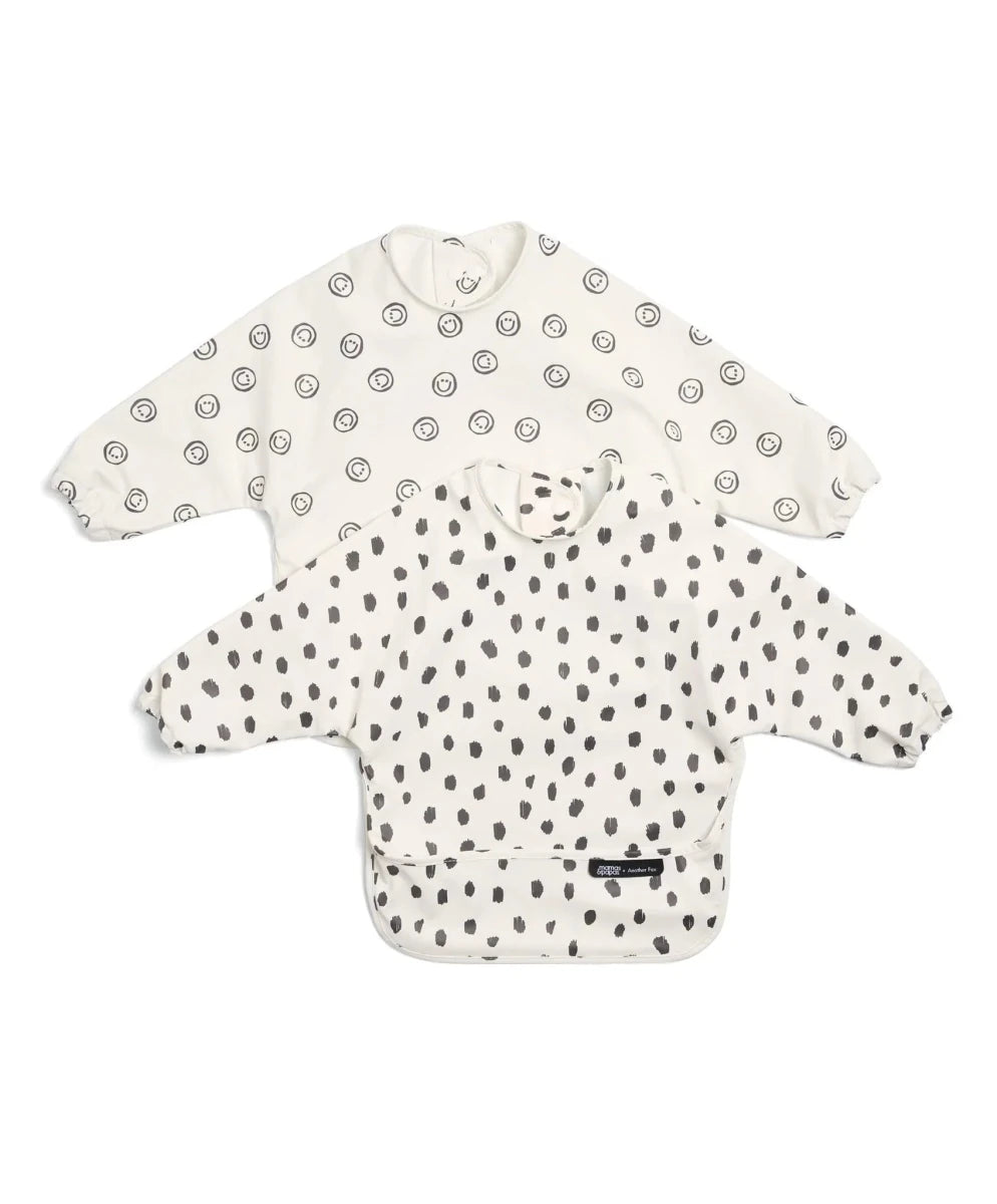 Long-sleeve baby bib, off-white with fox-face and cheetah spot prints