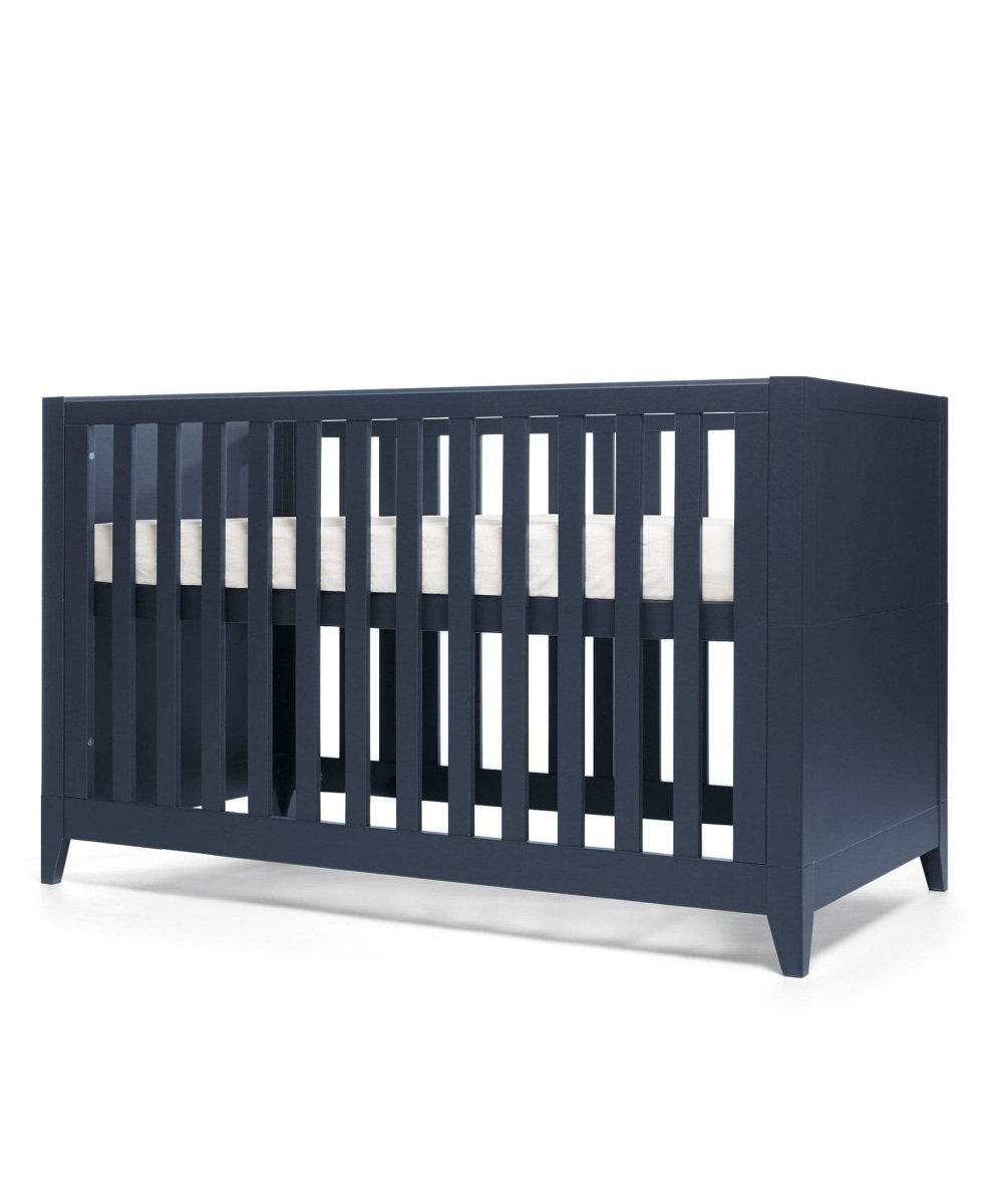 Midnight navy cotbed with vertical slats and open front, angled view