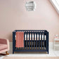 Midnight navy cotbed with tall vertical slats and open front