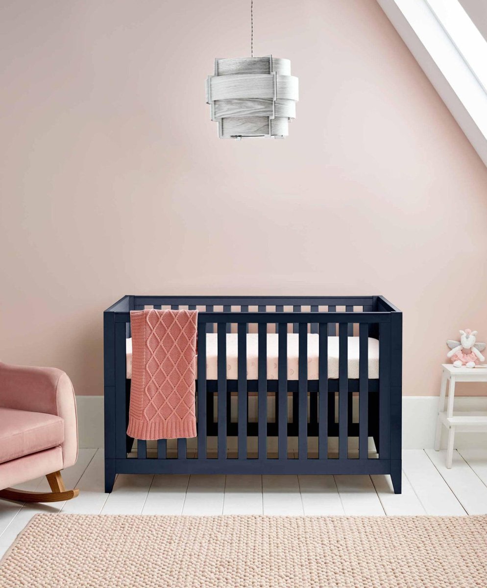 Midnight navy cotbed with tall vertical slats and open front