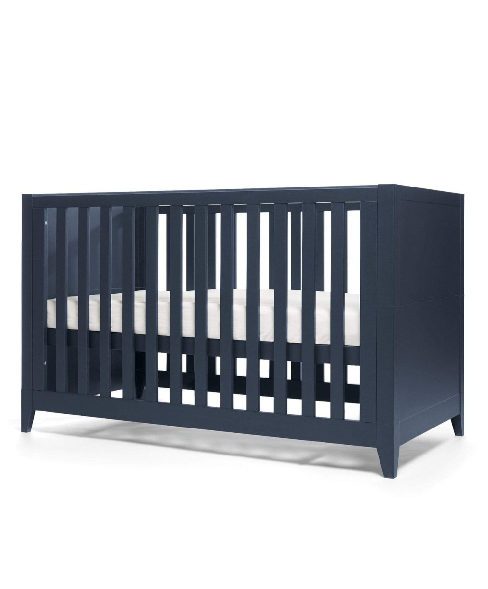 Midnight navy cotbed with vertical slats and open front, angled view