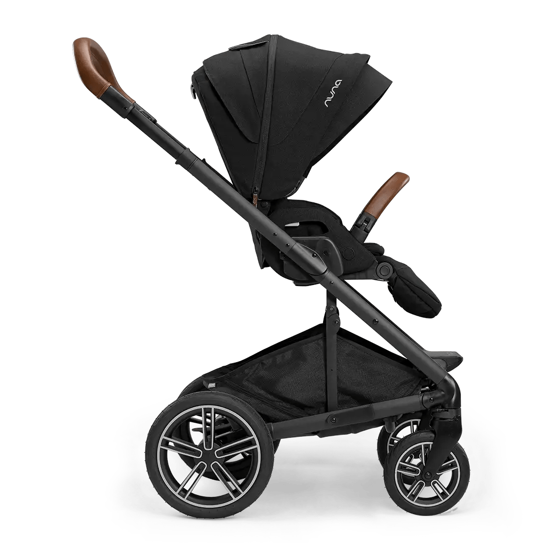 MIXX Next stroller with black canopy, brown leather-style handle grips, side view.