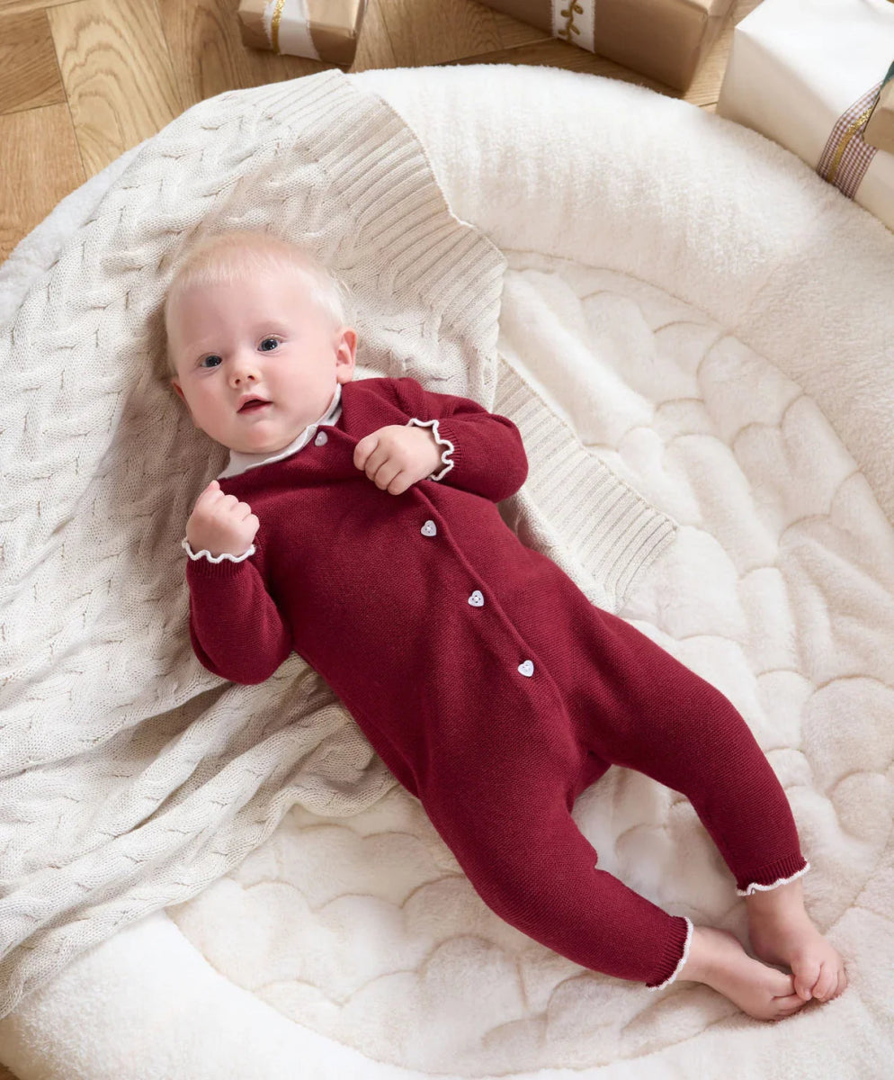 Burgundy Santa-style romper with white scalloped collar and button front
