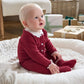 Burgundy Santa-style footed romper with white collar, snap button placket