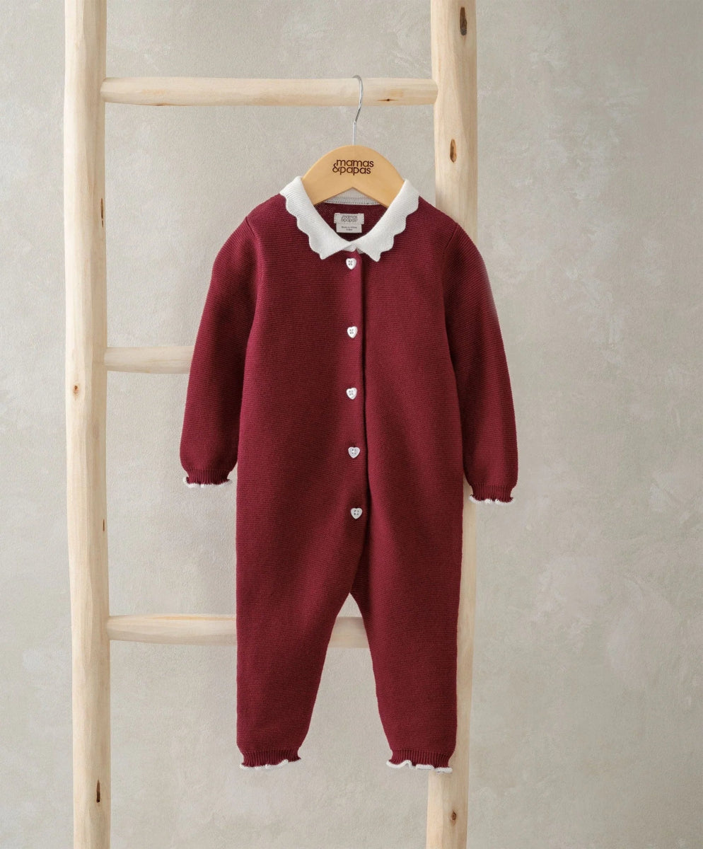 Burgundy long-sleeve Santa romper with white scalloped collar and snap buttons