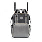 Black mummy backpack with gray front panel, shoulder straps, and top handle