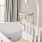 Baby musical mobile on crib with star, cloud, and moon ornaments