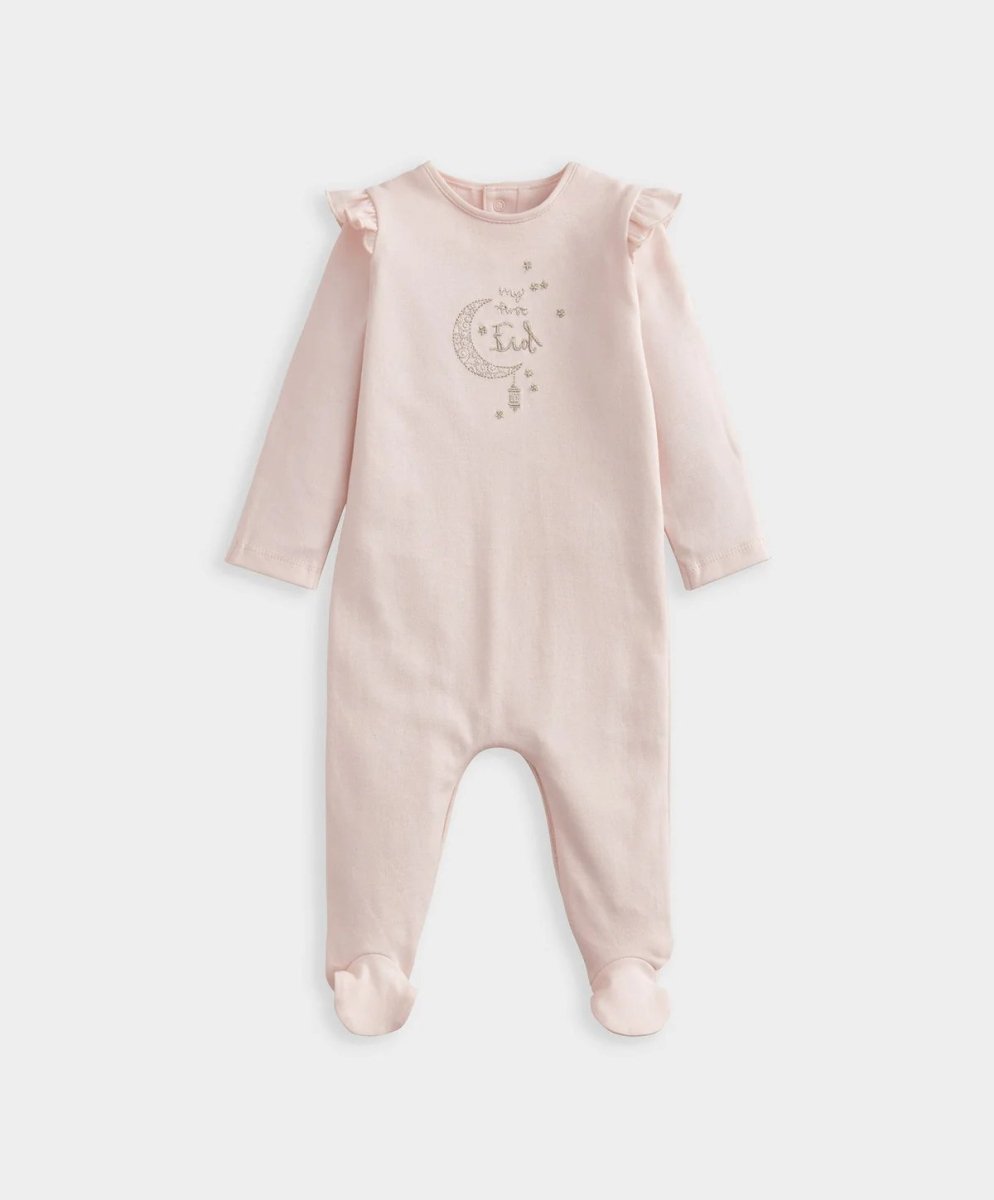 Pink baby Eid all-in-one romper with ruffled shoulders, long sleeves, and front graphic