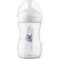 Baby feeding bottle in clear plastic with blue animal and leaf pattern, white base