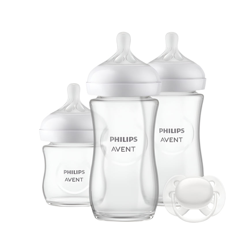 Set of four clear feeding bottles with white nipples and Philips Avent labels