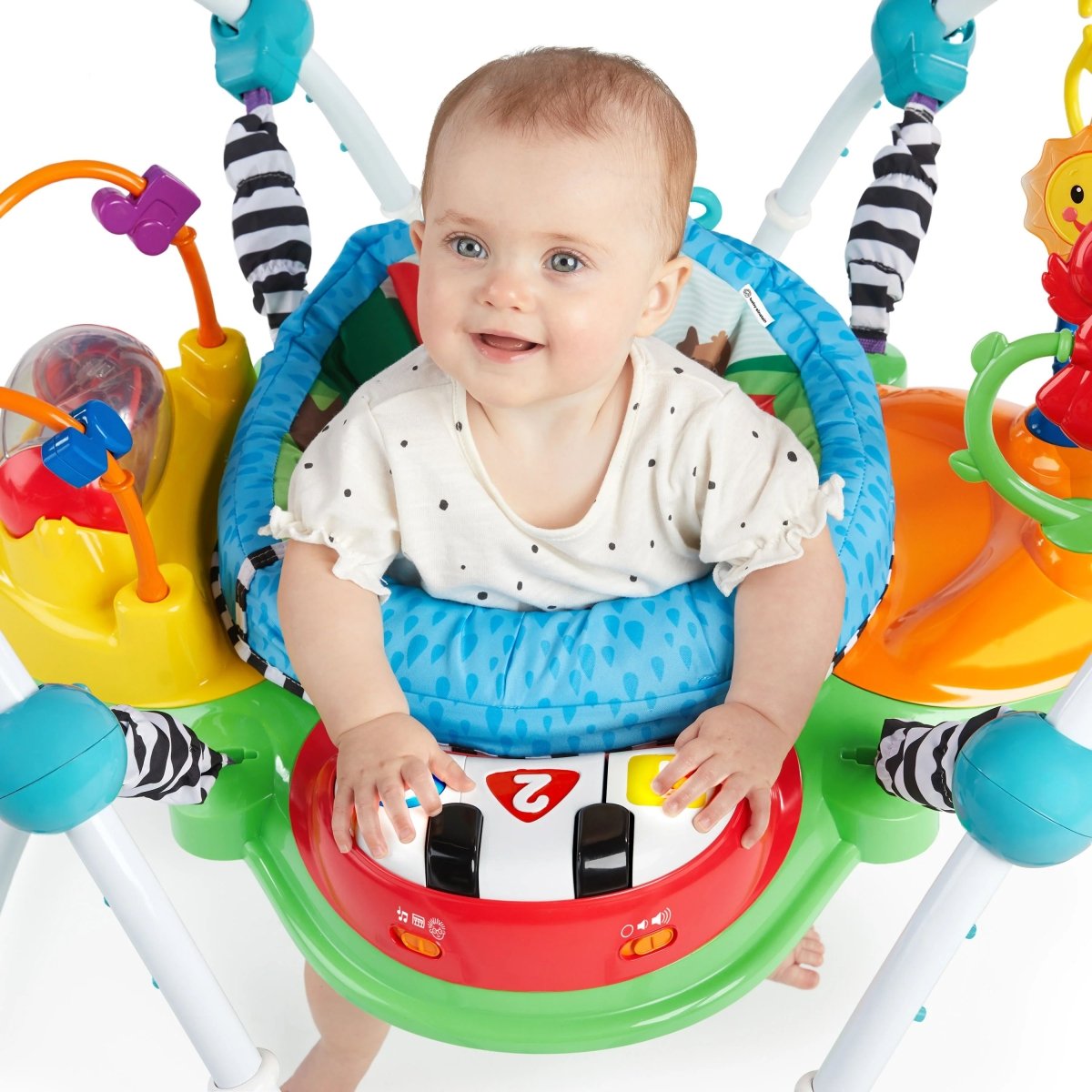 Activity jumper seat with multi-colored toys and a smiling baby face