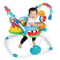 Activity jumper with arched toy frame, green base, and smiling baby