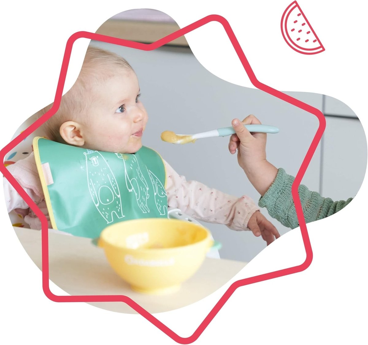 Pastel feeding bowl with flexible spoon, baby holding spoon in high chair