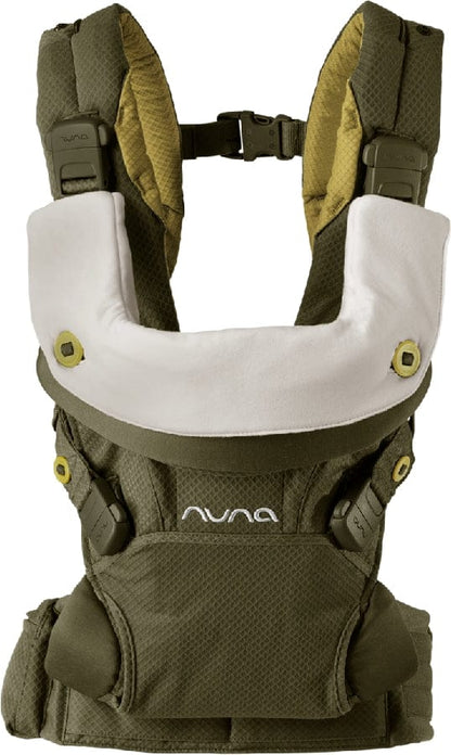 Dark green baby carrier with white headrest, adjustable straps, front waist belt, nuna logo