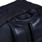 Nursery backpack side panel with carry handle and zippered front pocket on dark fabric