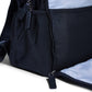 Nursery backpack with textured dark front panel, zip pocket, and adjustable shoulder strap