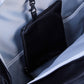 Nursery backpack interior with black pouch and partially open zipper compartment