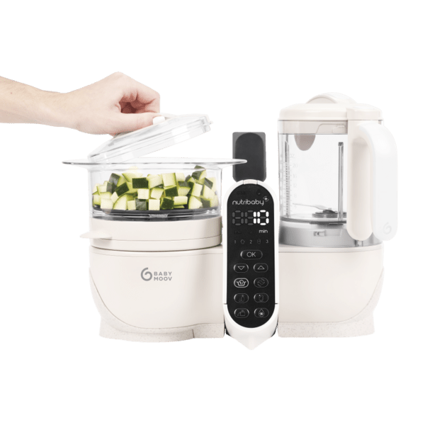 White baby food processor with one open container, diced vegetables, jug and control panel.