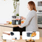 Baby food processor with two clear jars on countertop, dark gray base and mint lid