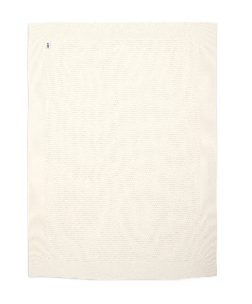 Travel blanket in off-white textured fabric, flat view