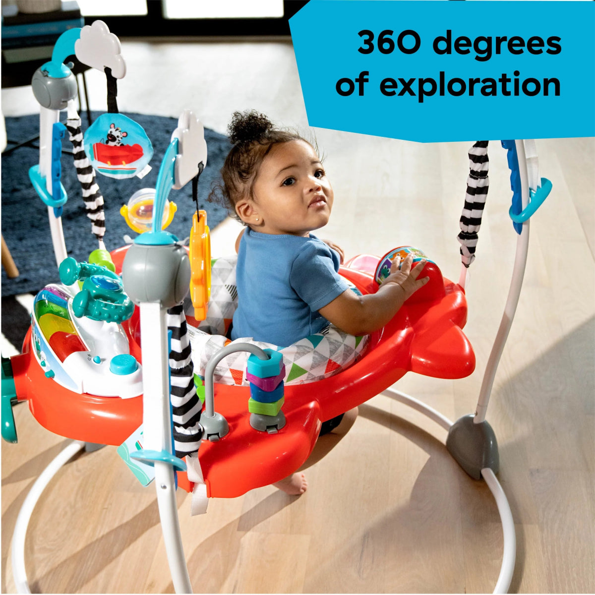 2-in-1 baby activity jumper with red seat, blue frame, and hanging colorful toys