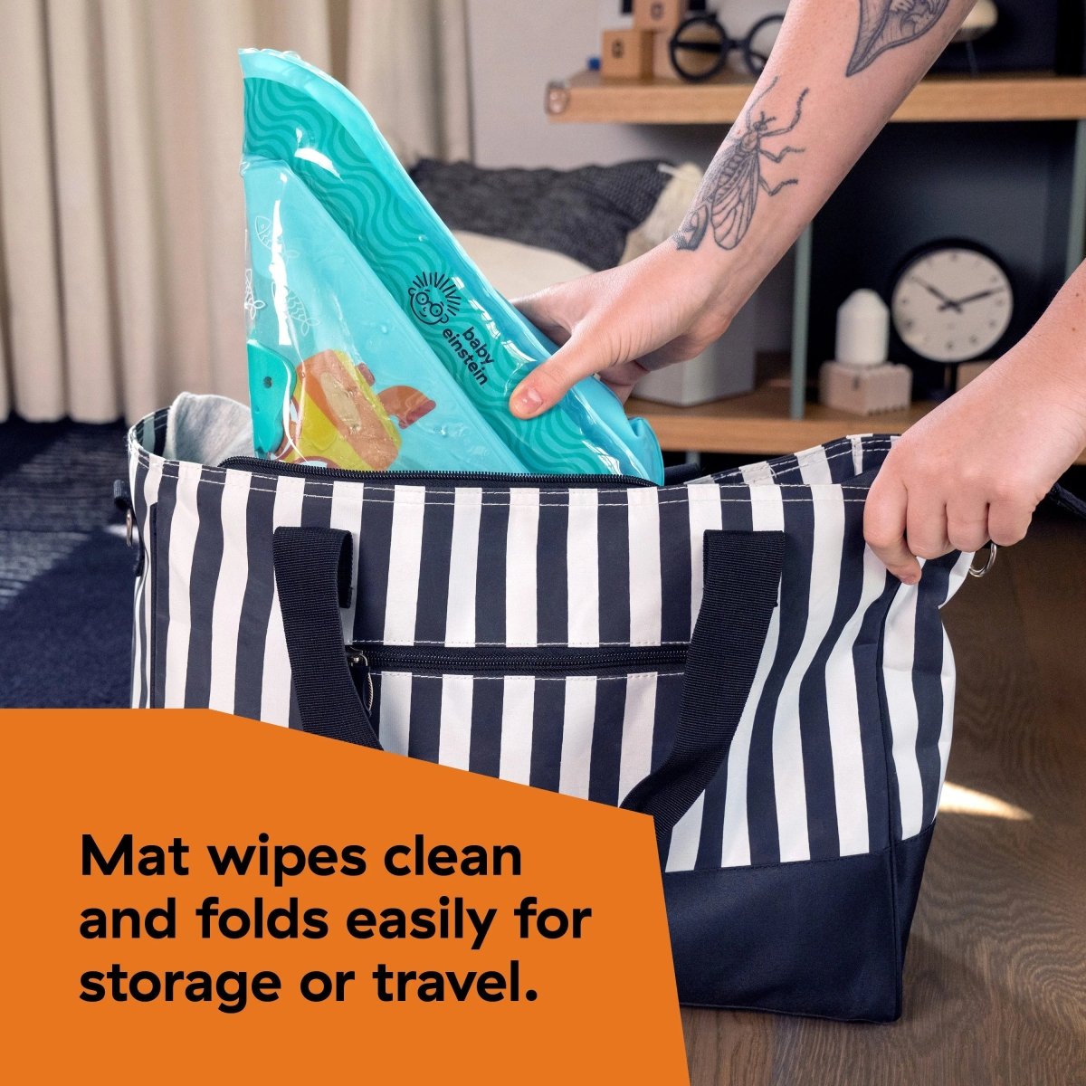 Turquoise water mat being unfolded from striped storage bag