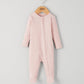 Pink ribbed zip sleepsuit with long sleeves and footed legs, front zipper