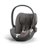 Dark grey i-Size car seat with carry handle, side wings, harness and infant insert