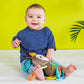 Plush take-along activity toy with dangling sensory parts and colorful striped accents.