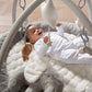 Elephant playmat gym with gray cushion and arch, hanging toys above baby at play