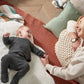 Soft white play mat with plush toy attachments