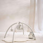 Cloud-themed play mat gym with arched frame and hanging star, moon, and plush toys