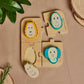 Wooden animal puzzle game with animal face puzzle pieces on board