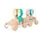 Wooden safari jeep toy with teal and cream animal-face blocks and rolling wheels
