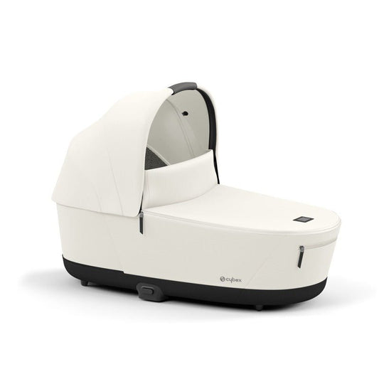 Luxury carrycot in off-white with hood and dark trim on the carry handle