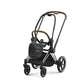 Chrome stroller frame with brown handle trim and black seat