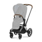 Chrome stroller frame with brown handle trim and four-wheel base