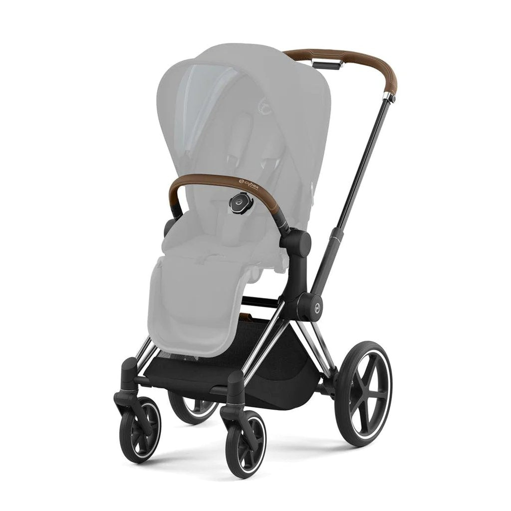 Chrome stroller frame with brown handle trim and four-wheel base