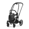 Compact stroller with black seat and canopy, chrome frame, and large wheels